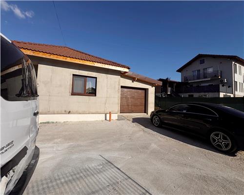 Casa noua, 3 dormitoare, 2 bai, terasa si 2 garaje, Mocira